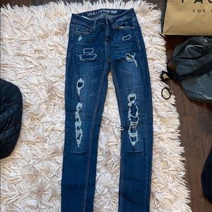 dark blue distressed jeans